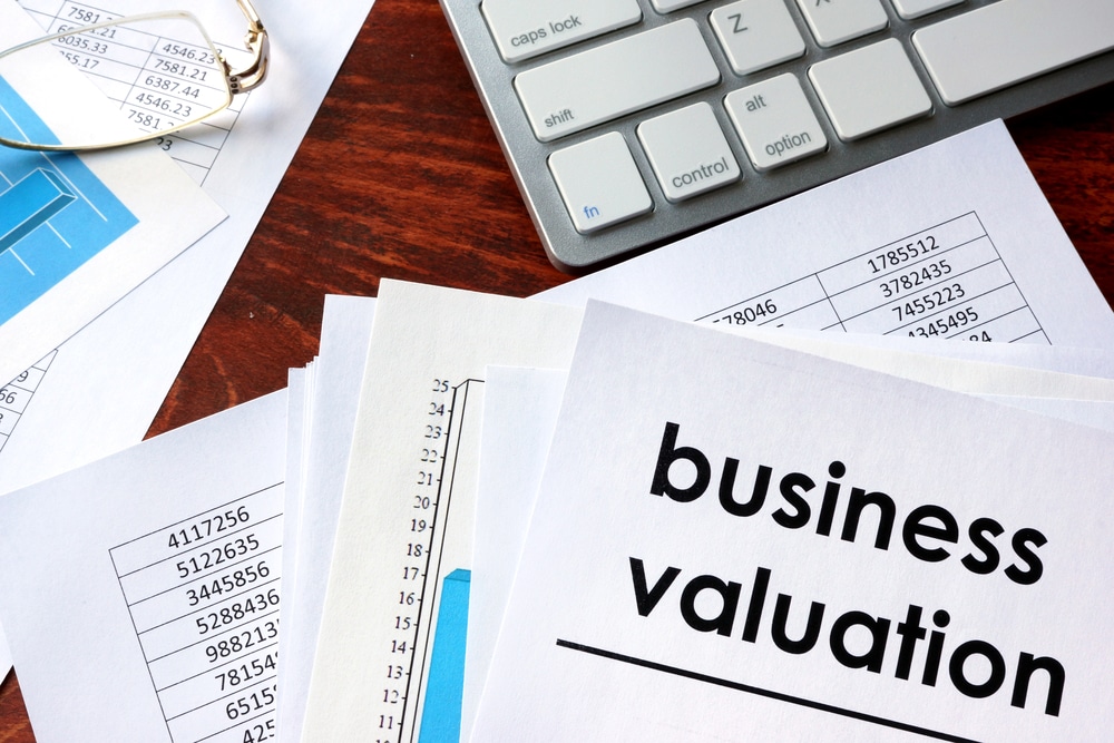 Business,Valuation,Written,In,A,Document,And,Business,Charts.